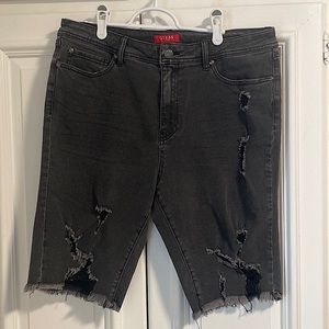 Black ripped GUESS jean shorts.